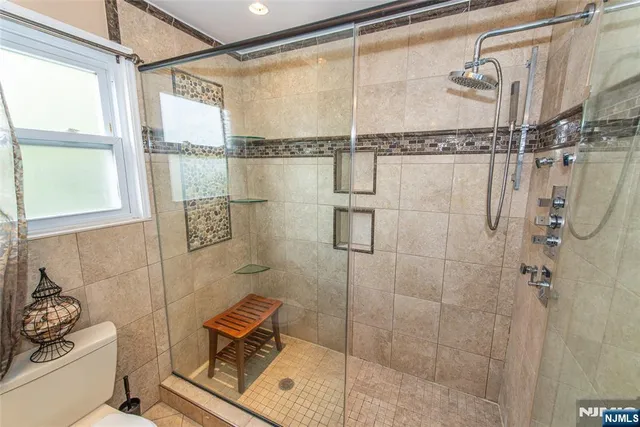 a bathroom with a shower and a bathtub
