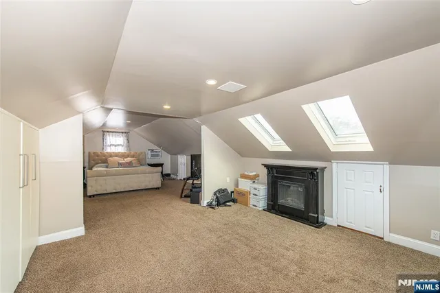 a view of a livingroom with furniture and a fireplace
