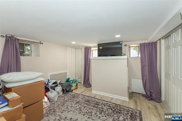 a living room with a couch and a window