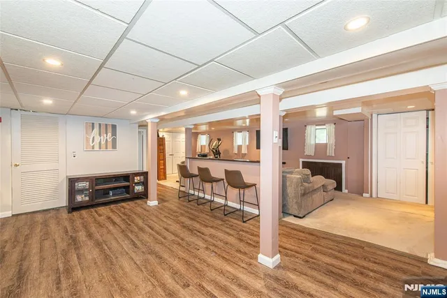 a bedroom with furniture and a wooden floor