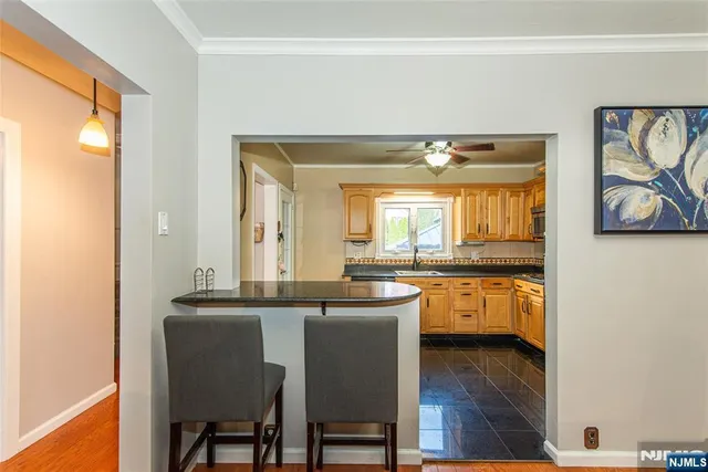 a dining room with table and chairs