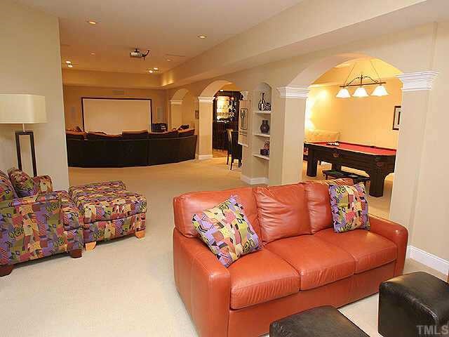 9508 Bluemont Court Raleigh, NC 27617 - Photo 6 of 10 a living room with a couch and a view of kitchen