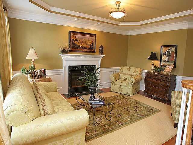 9508 Bluemont Court Raleigh, NC 27617 - Photo 9 of 10 a living room with furniture and a fireplace