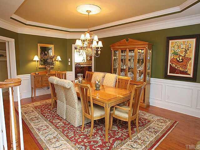 9508 Bluemont Court Raleigh, NC 27617 - Photo 10 of 10 a view of a dining room with furniture a chandelier and wooden floor