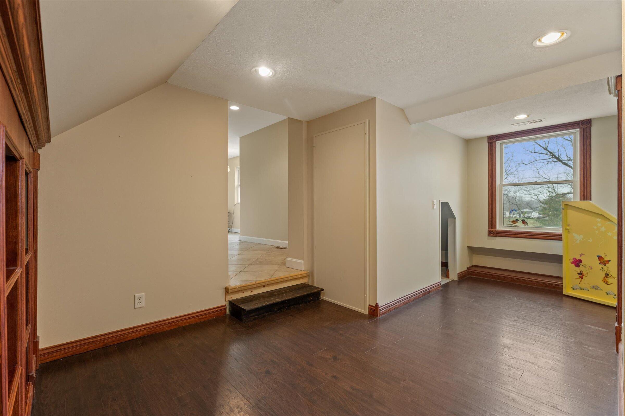 7692 North Emery Road Rolling Prairie, IN 46371 - Photo 40 of 69 a view of room with window and wooden floor