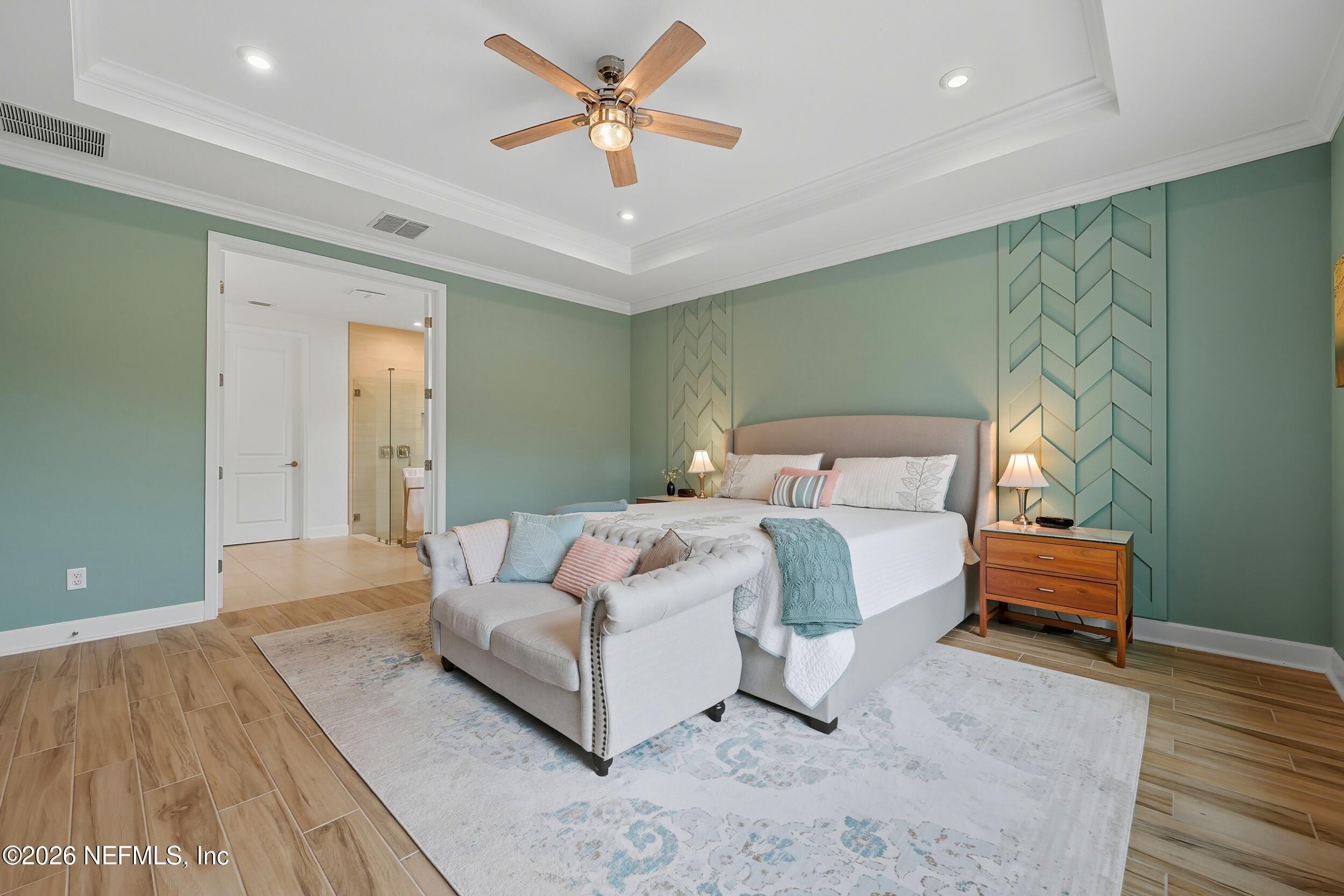 494 Marquesa Circle St. Johns, FL 32259 - Photo 24 of 76 a bedroom with a bed and a chandelier