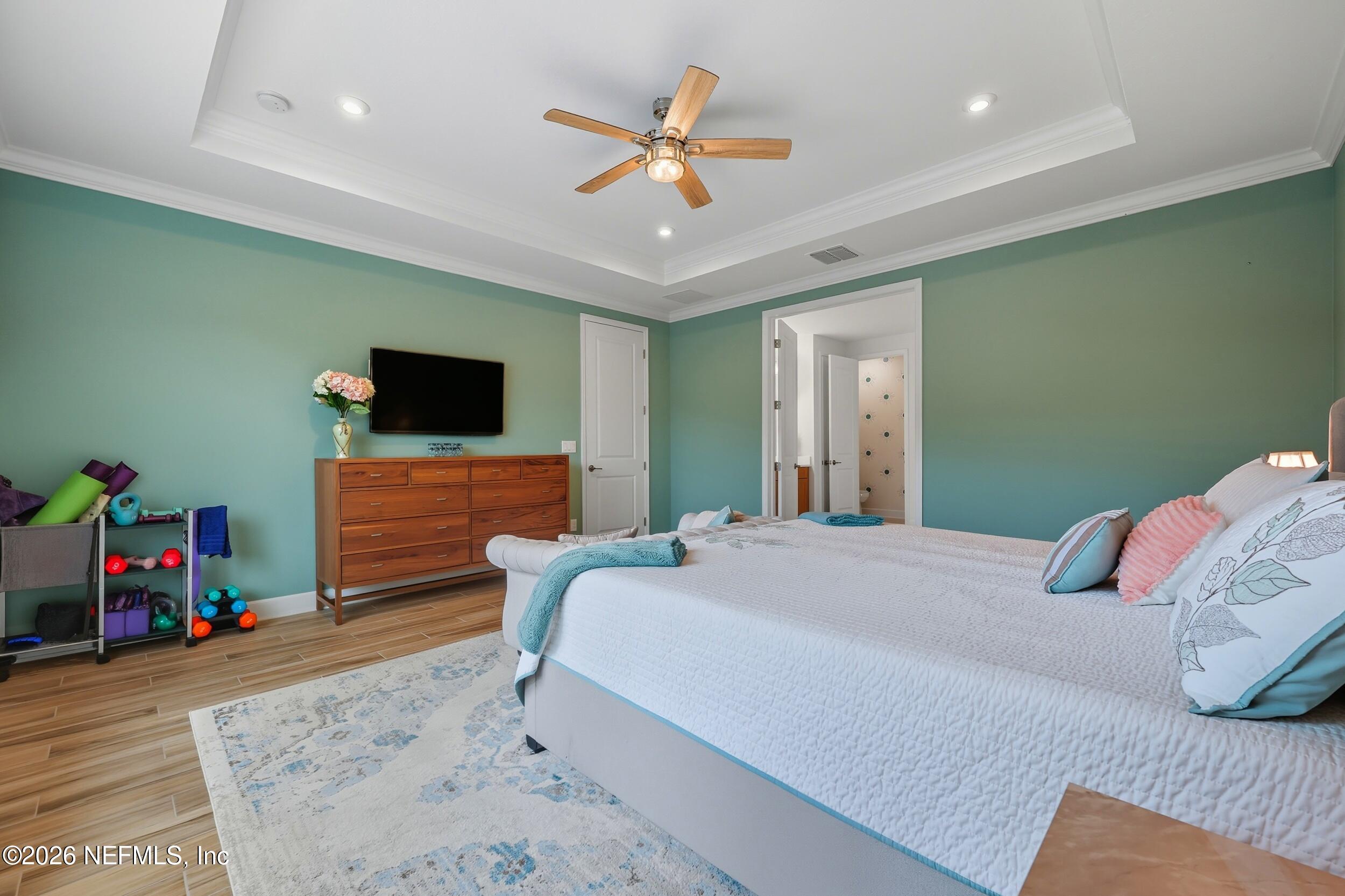 494 Marquesa Circle St. Johns, FL 32259 - Photo 25 of 76 a bedroom with a bed and a flat screen tv