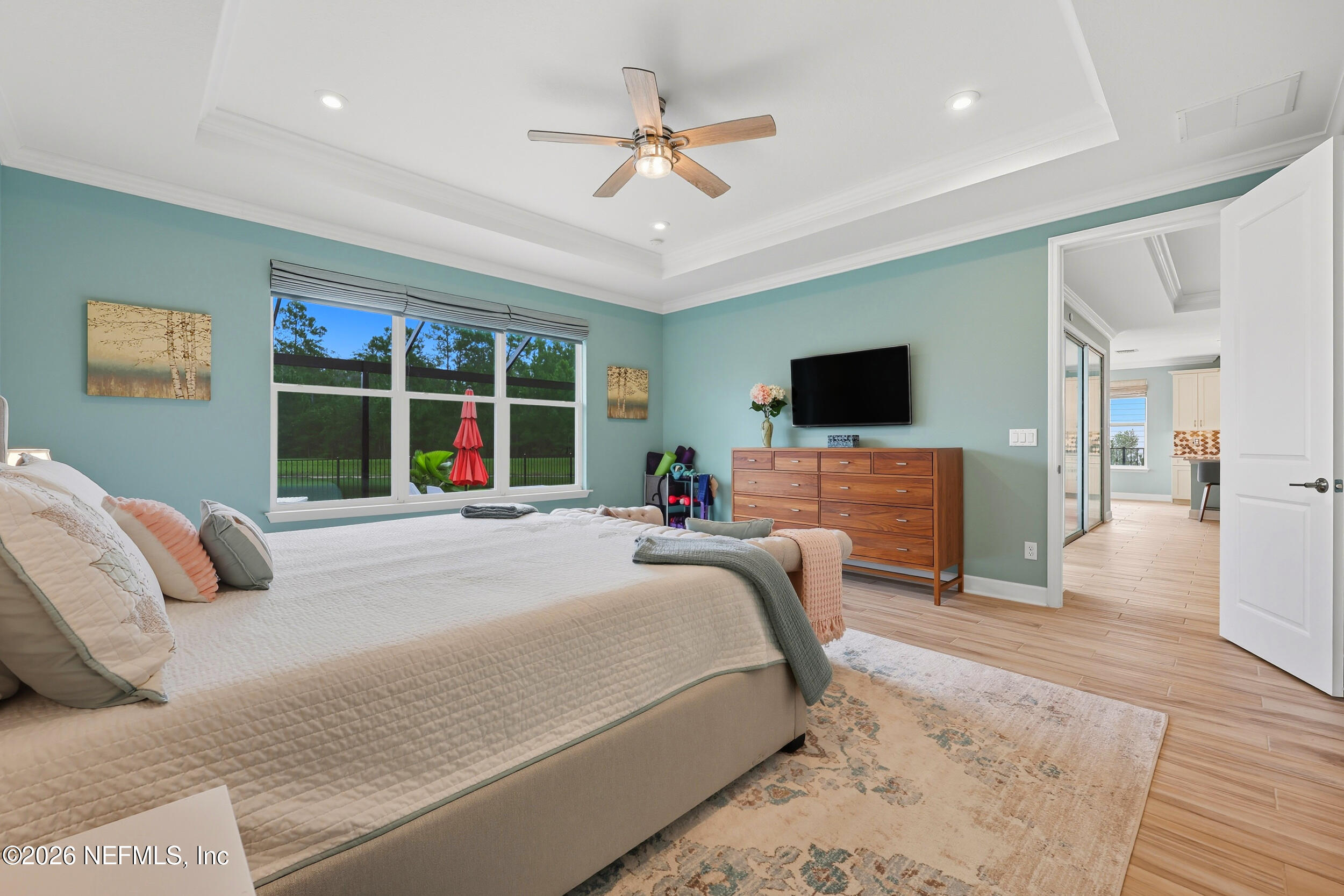 494 Marquesa Circle St. Johns, FL 32259 - Photo 26 of 76 a bed room with a bed a television and a large window