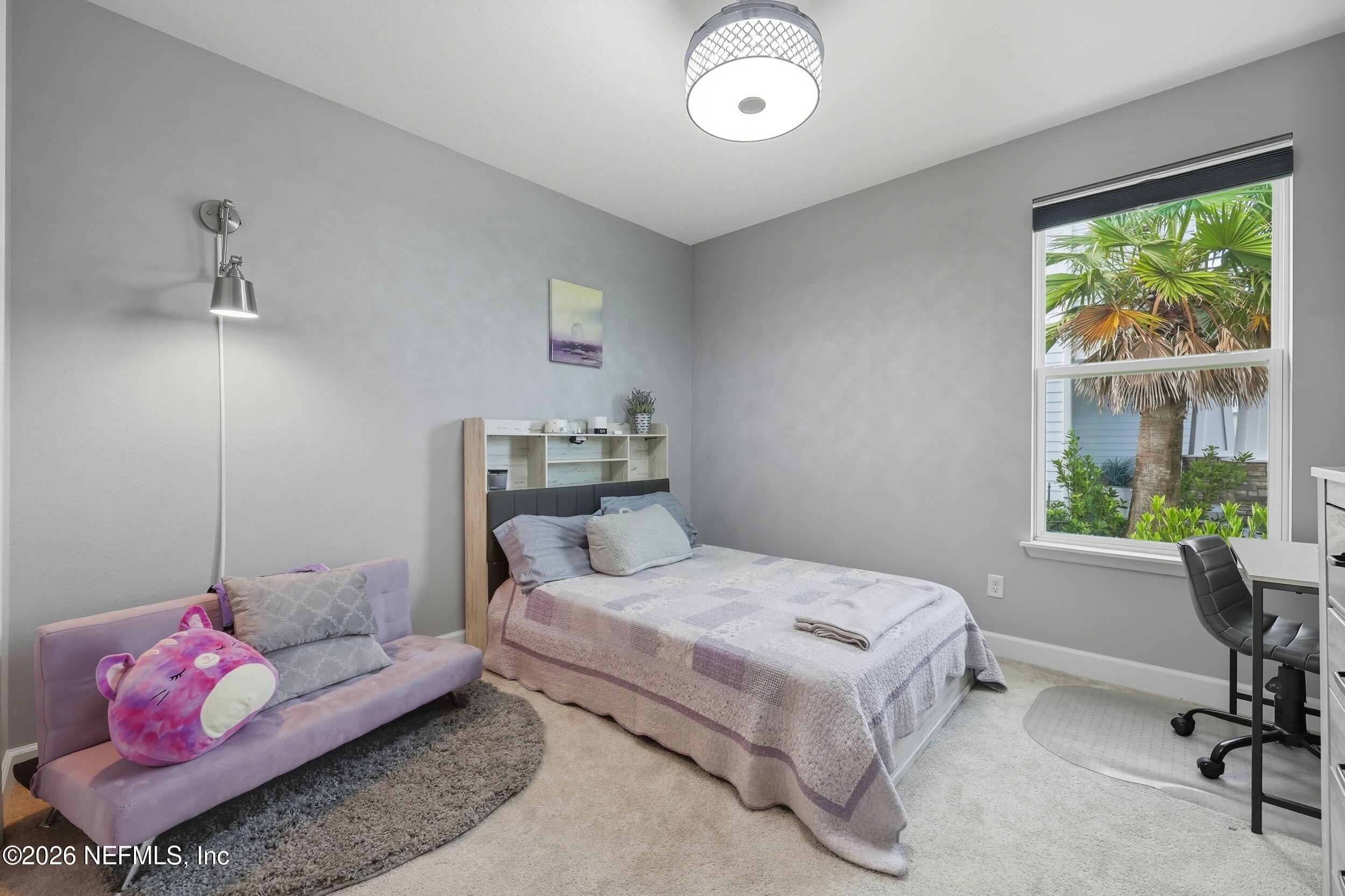 494 Marquesa Circle St. Johns, FL 32259 - Photo 38 of 76 a bedroom with a bed and wooden floor