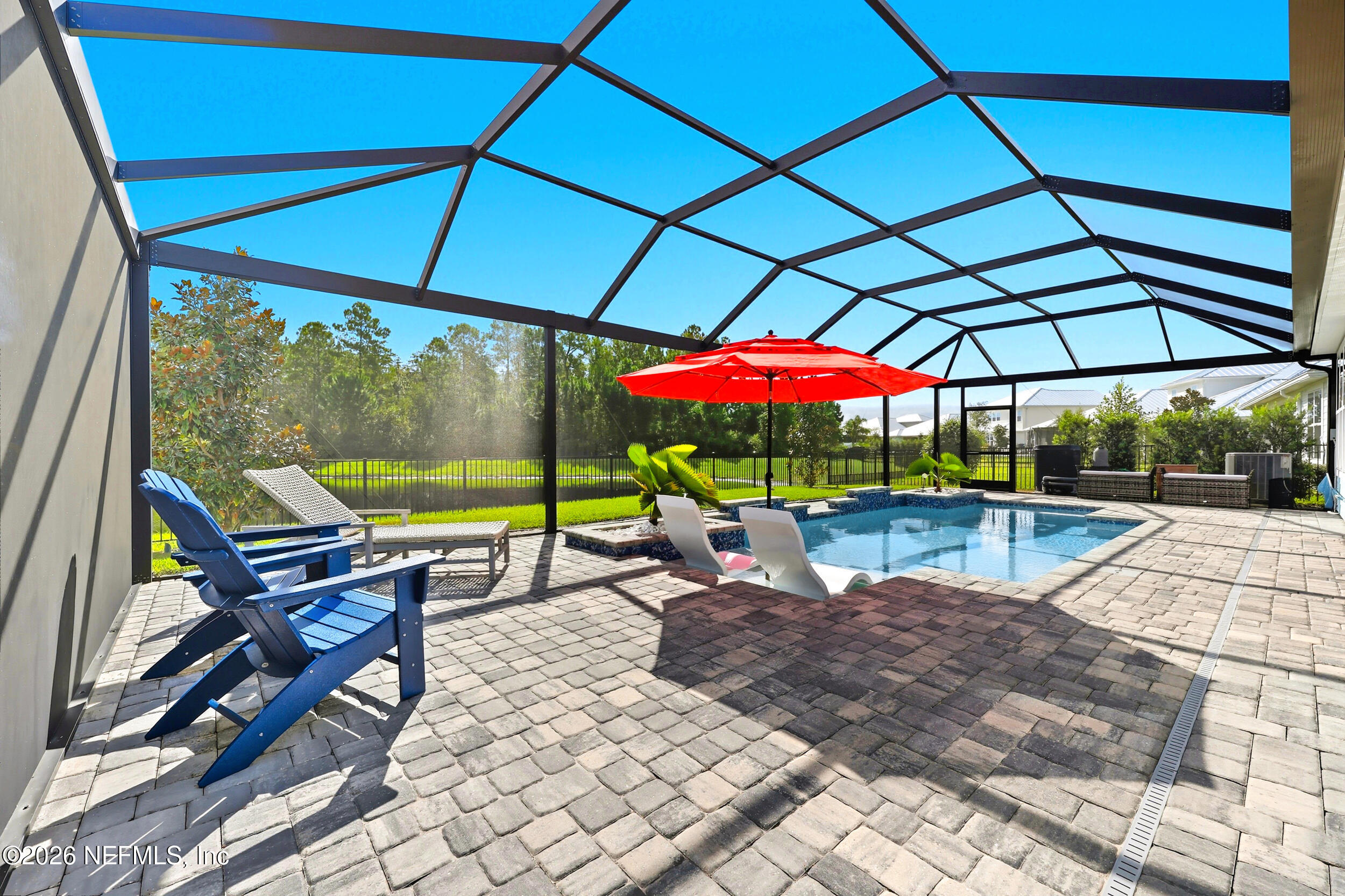 494 Marquesa Circle St. Johns, FL 32259 - Photo 45 of 76 a view of a deck with a table and chairs under an umbrella