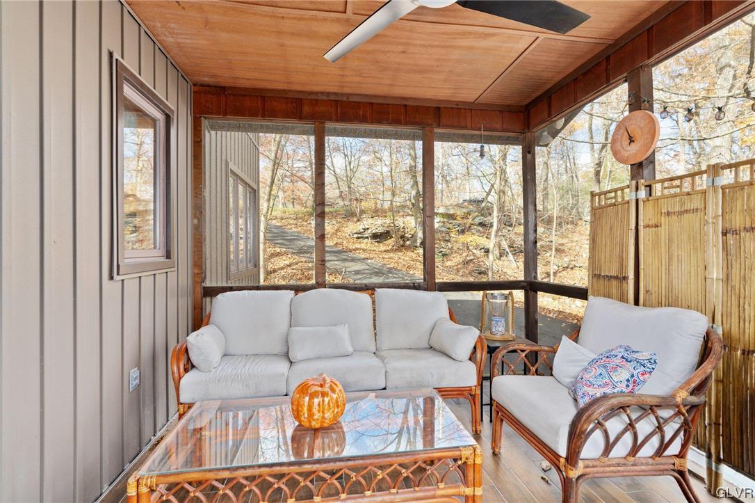 3215 Cherry Ridge Road Bushkill, PA 18324 - Photo 11 of 50 a living room with furniture and a large window