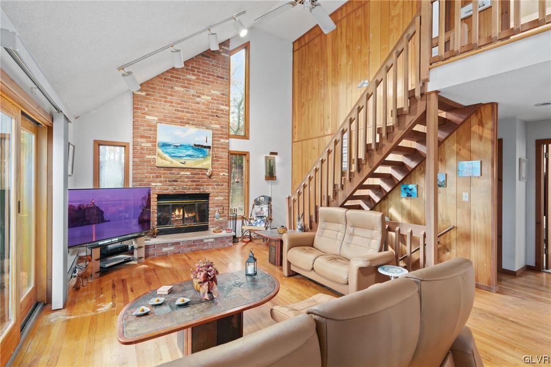 3215 Cherry Ridge Road Bushkill, PA 18324 - Photo 15 of 50 a living room with fireplace furniture and a fireplace