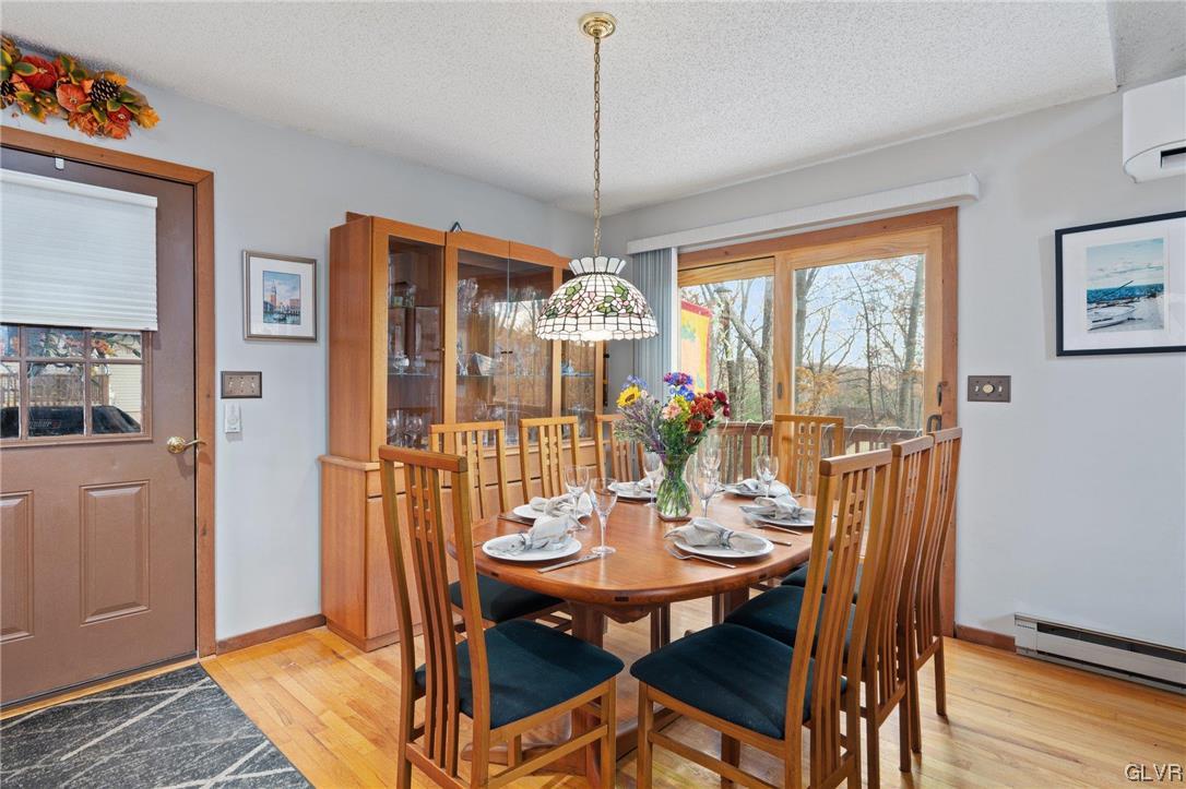 3215 Cherry Ridge Road Bushkill, PA 18324 - Photo 20 of 50 a view of a dining room with furniture window and wooden floor