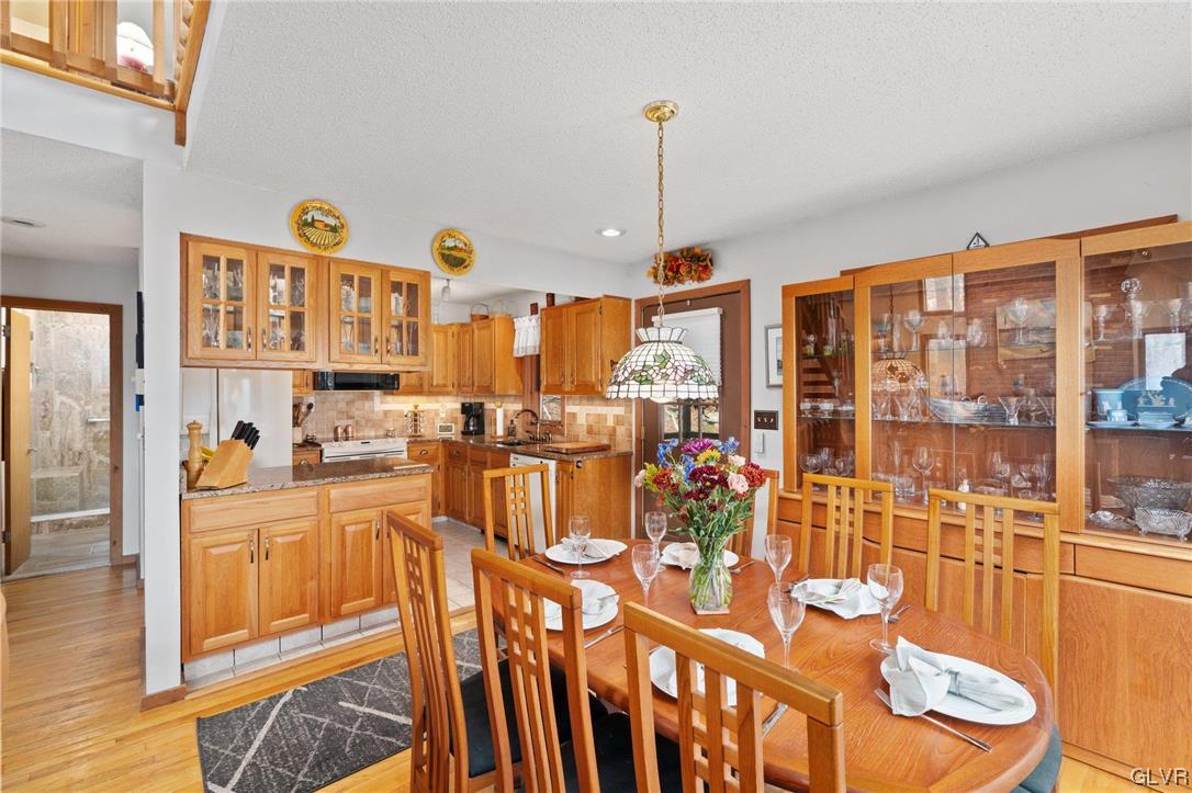 3215 Cherry Ridge Road Bushkill, PA 18324 - Photo 21 of 50 a very nice looking living room with a large window and kitchen view