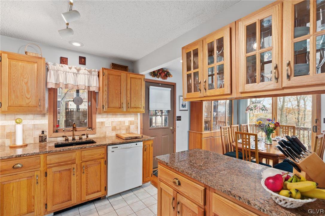 3215 Cherry Ridge Road Bushkill, PA 18324 - Photo 26 of 50 a kitchen with a sink stove and cabinets