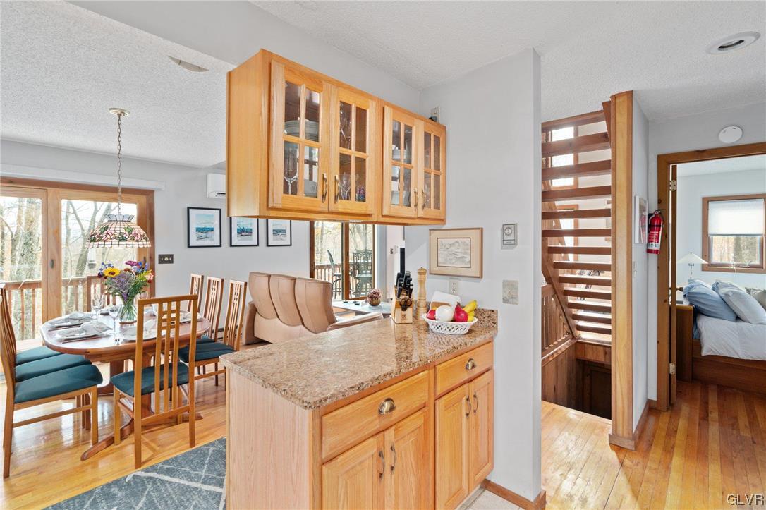 3215 Cherry Ridge Road Bushkill, PA 18324 - Photo 27 of 50 a view of a kitchen area with furniture and wooden floor