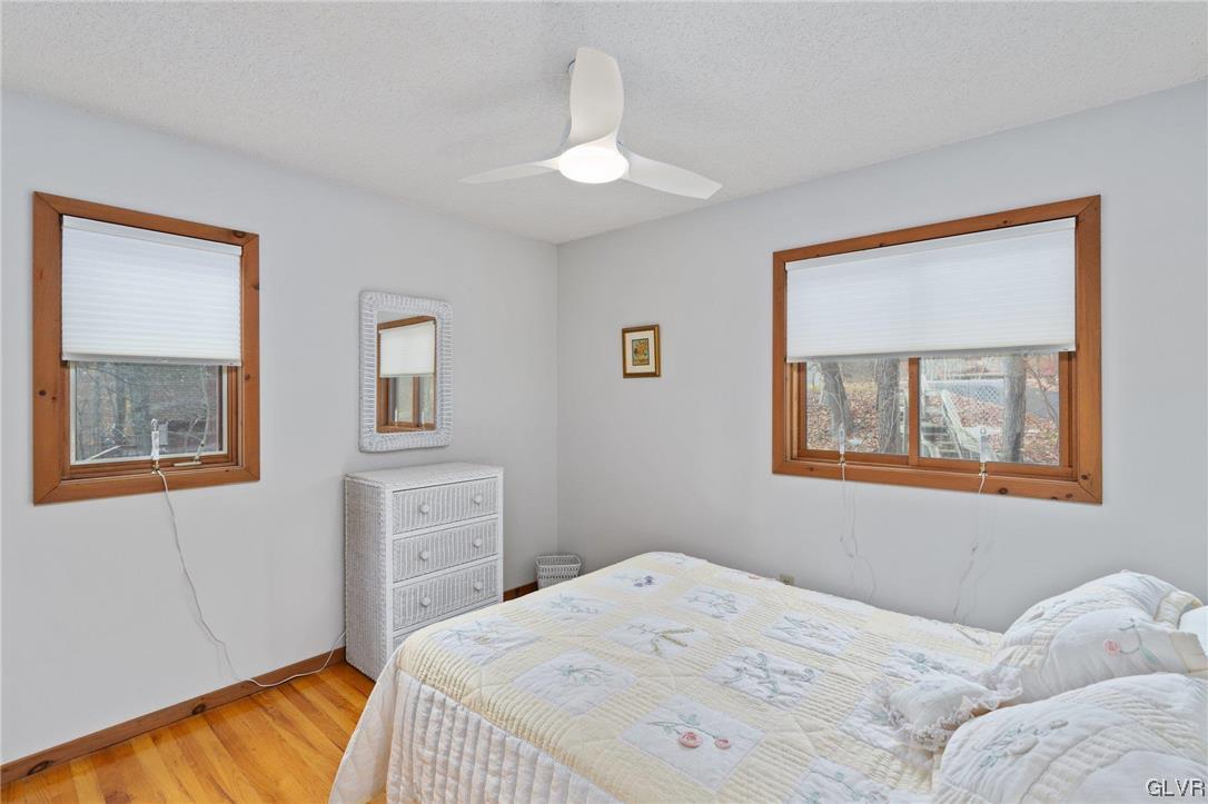 3215 Cherry Ridge Road Bushkill, PA 18324 - Photo 38 of 50 a bedroom with a bed and a window