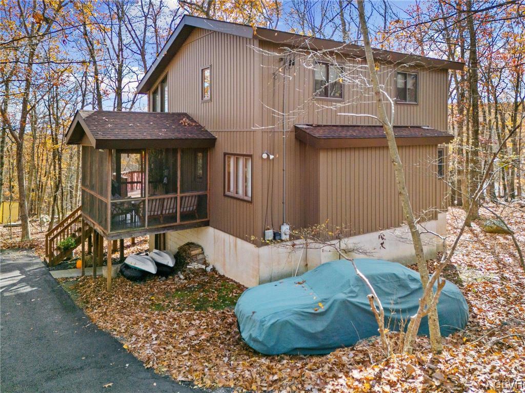 3215 Cherry Ridge Road Bushkill, PA 18324 - Photo 4 of 50 a view of a house with backyard and sitting area