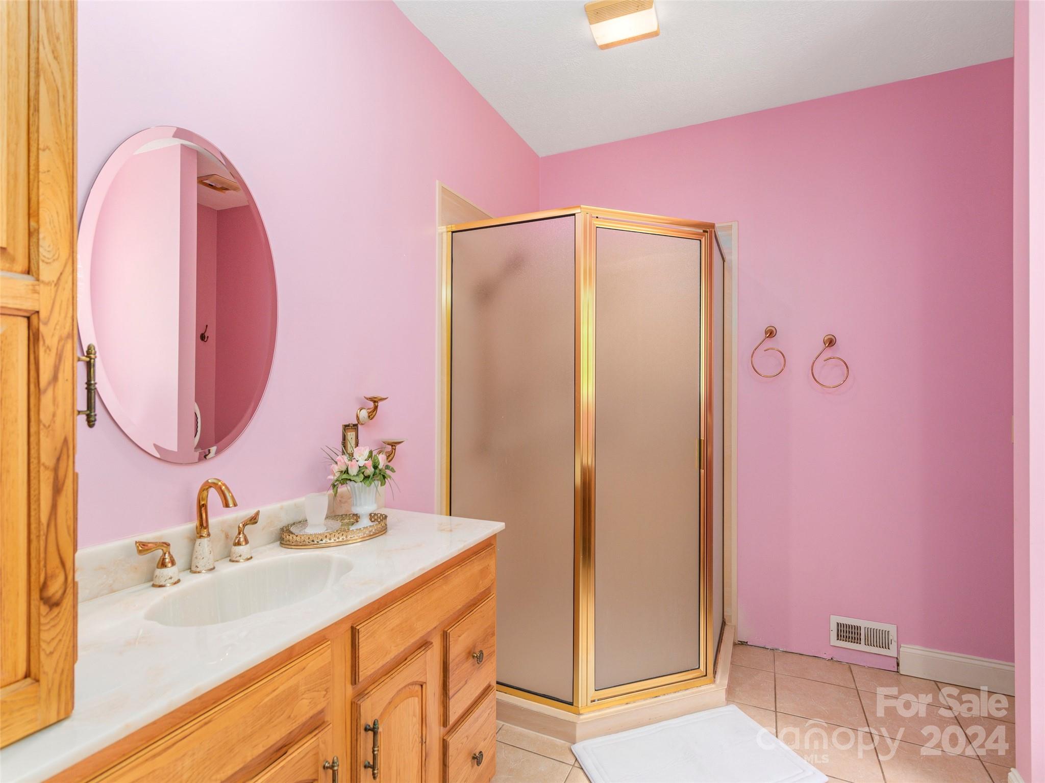 4113 Beaverdam Road Canton, NC 28716 - Photo 18 of 44 a bathroom with a granite countertop sink and a mirror