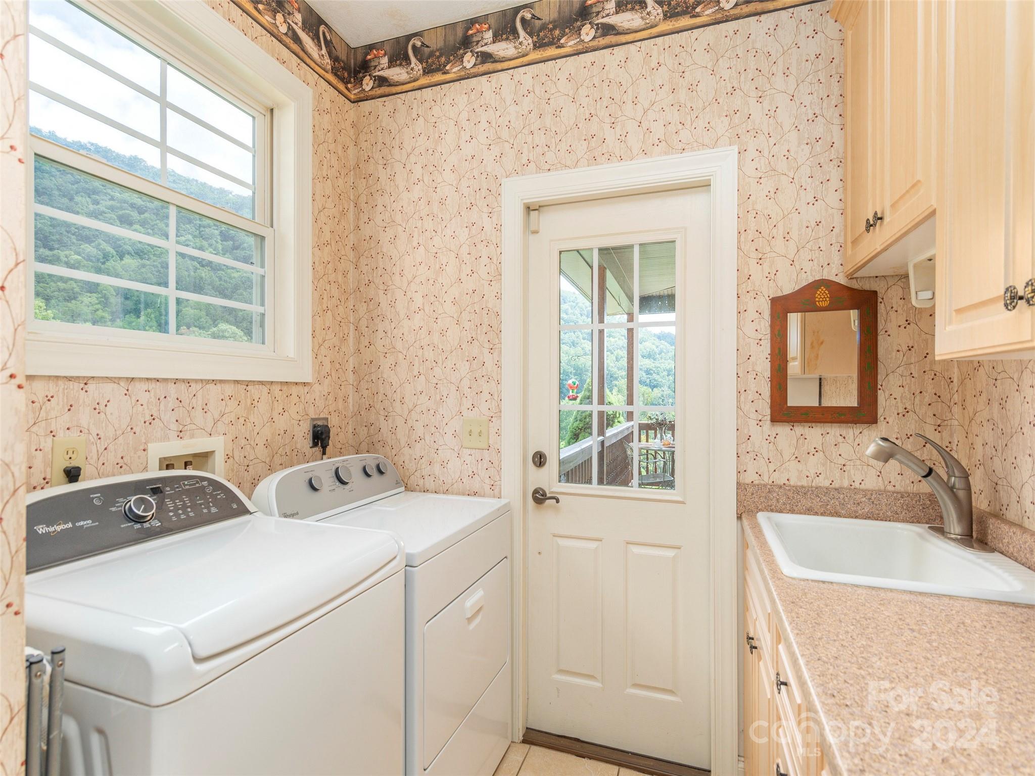 4113 Beaverdam Road Canton, NC 28716 - Photo 23 of 44 a utility room with dryer and washer