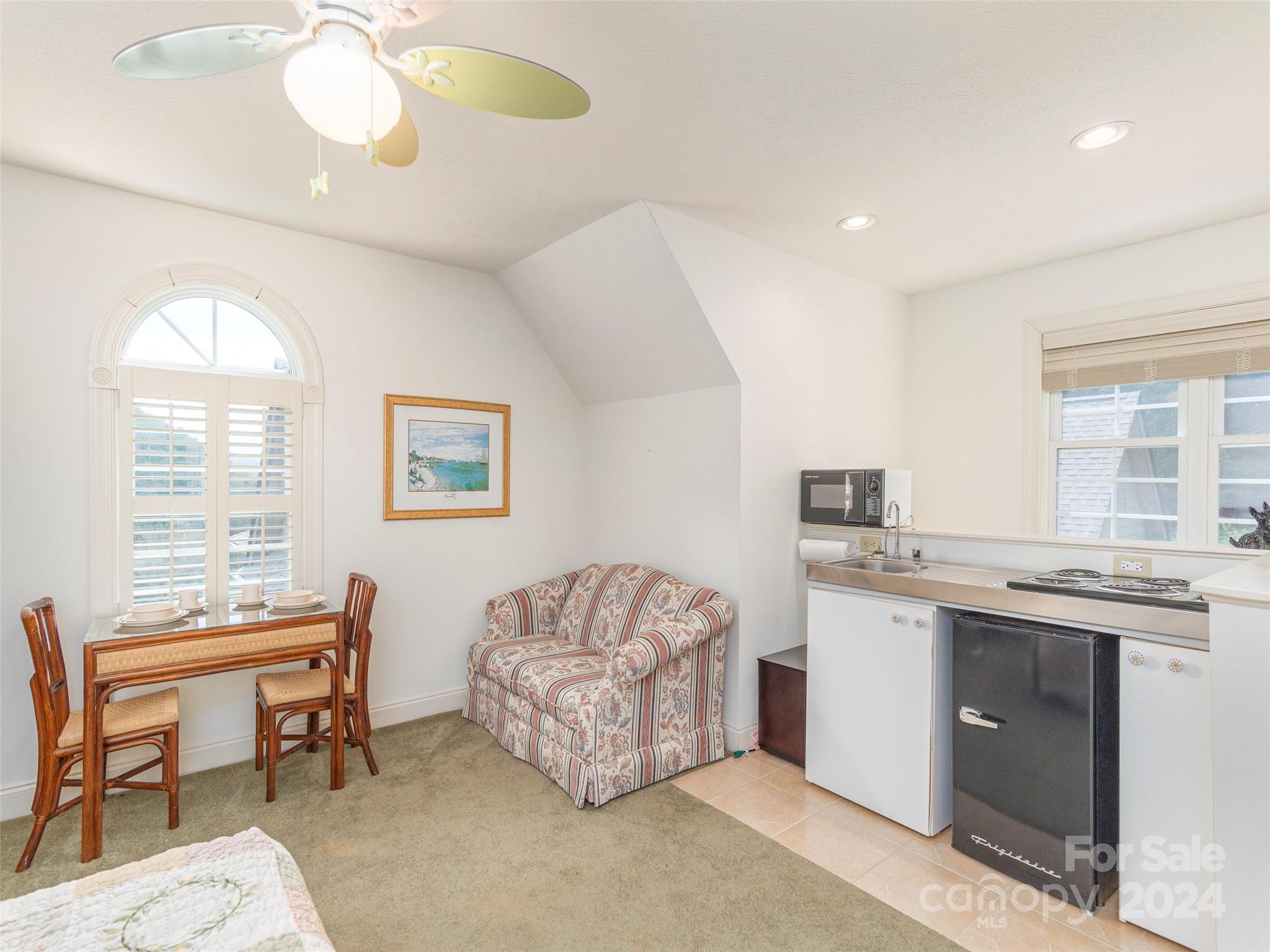 4113 Beaverdam Road Canton, NC 28716 - Photo 26 of 44 a living room with a couch and a chandelier