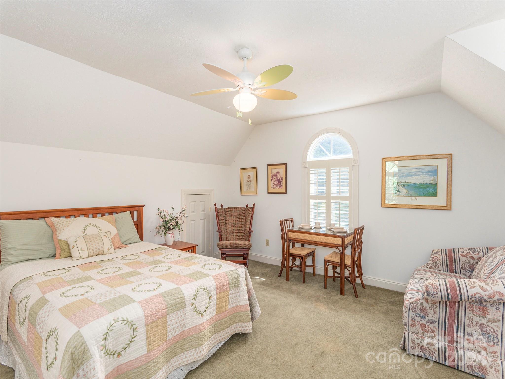 4113 Beaverdam Road Canton, NC 28716 - Photo 27 of 44 a bedroom with furniture and a large window