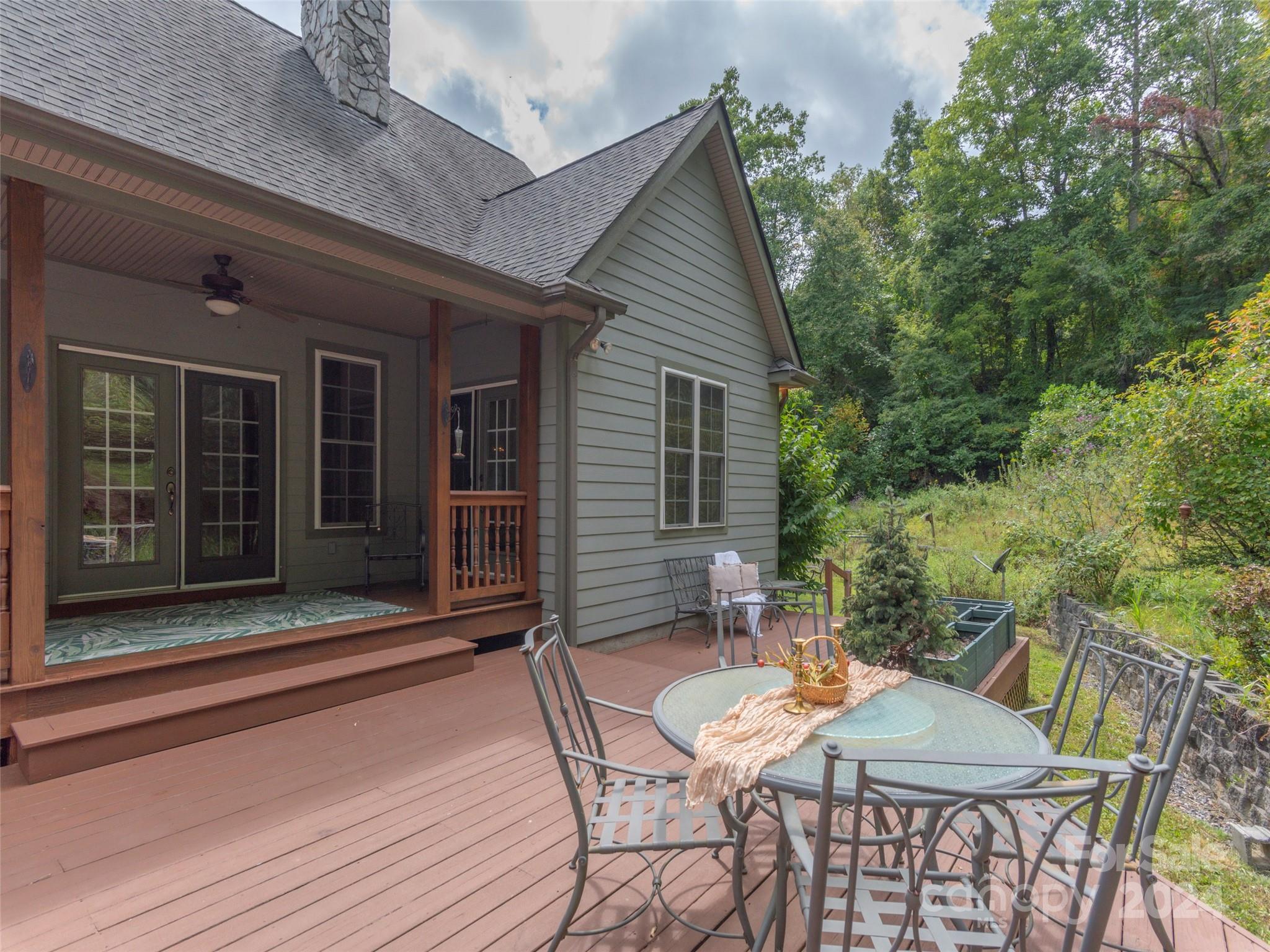 4113 Beaverdam Road Canton, NC 28716 - Photo 34 of 44 a backyard of a house with a table and chairs