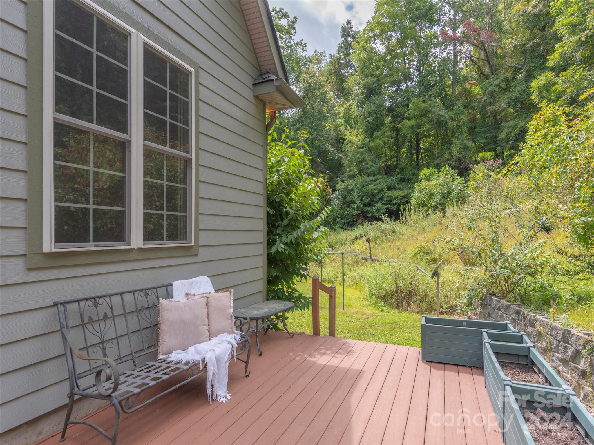 4113 Beaverdam Road Canton, NC 28716 - Photo 35 of 44 a view of a roof deck with wooden floor and fence