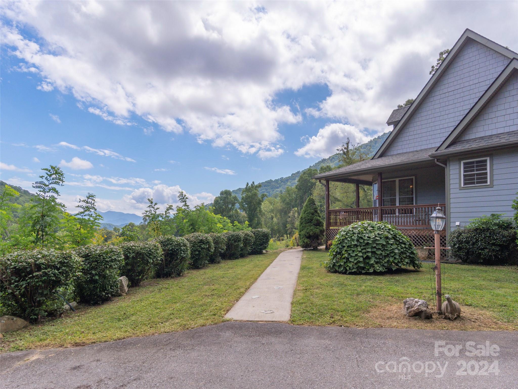 4113 Beaverdam Road Canton, NC 28716 - Photo 39 of 44 a view of a house with a yard