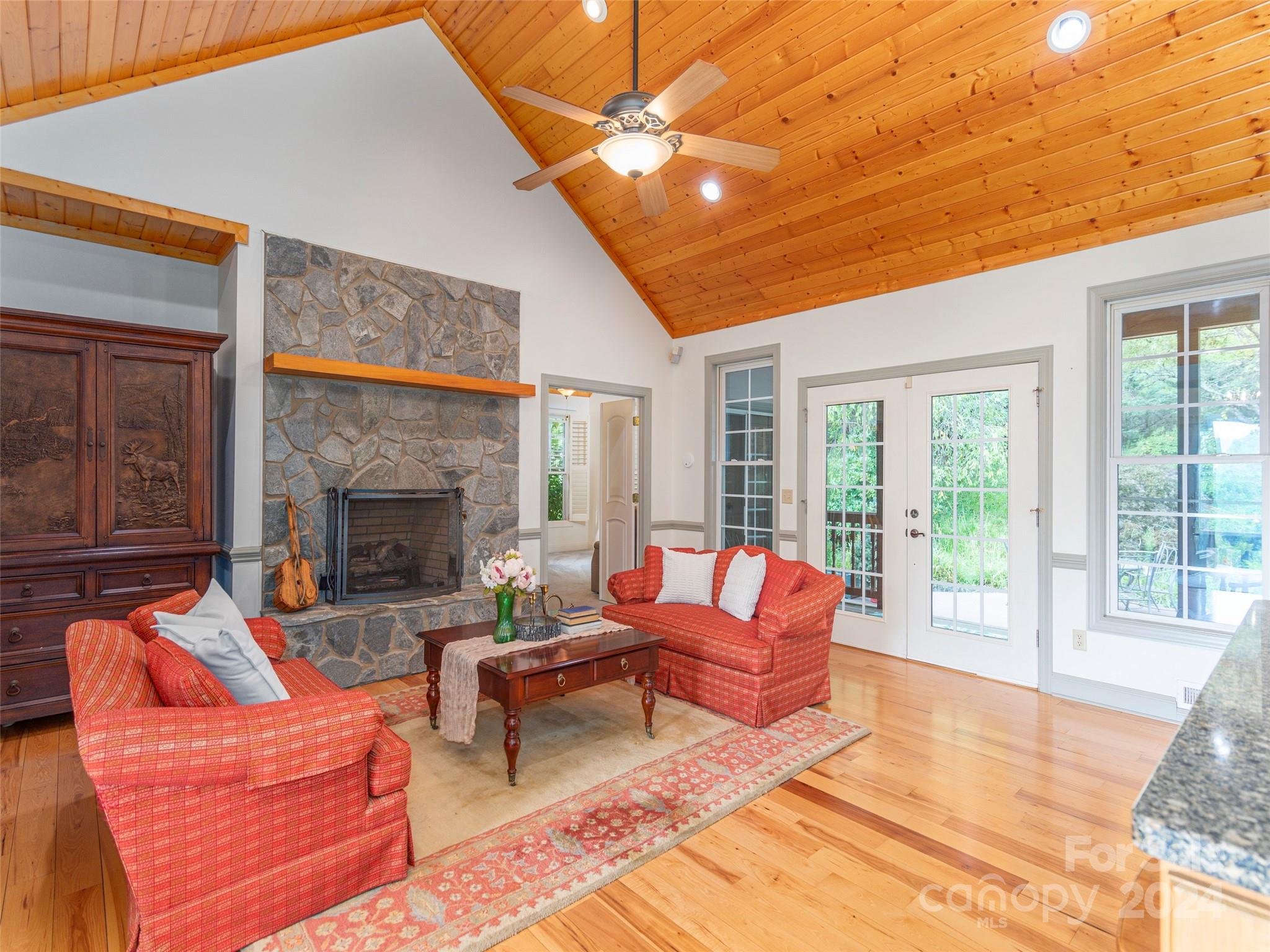 4113 Beaverdam Road Canton, NC 28716 - Photo 9 of 44 a outdoor living space with patio furniture and a fireplace