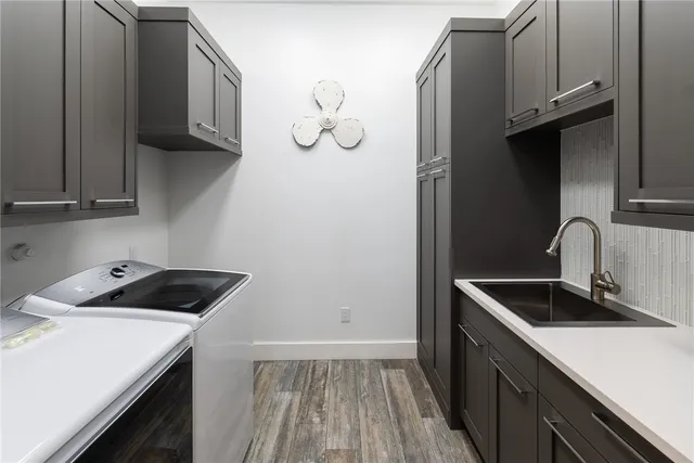 a kitchen with a sink and cabinets