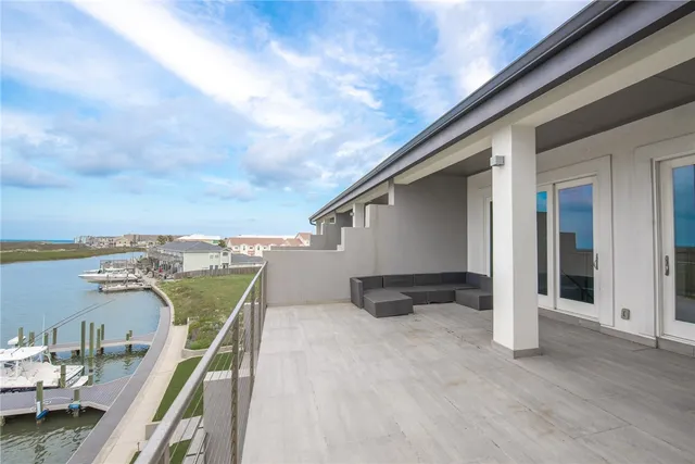a view of a balcony with furniture