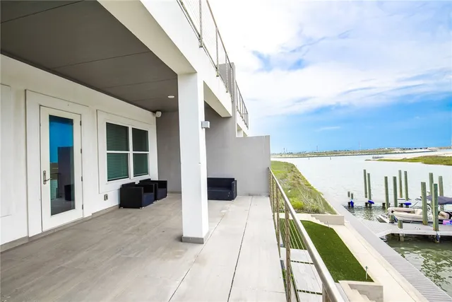 a view of a swimming pool with an outdoor seating