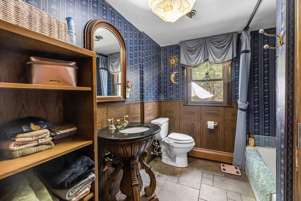 163 South Monson Road Hampden, MA 01036 - Photo 11 of 34 a bathroom with a sink a toilet and a mirror
