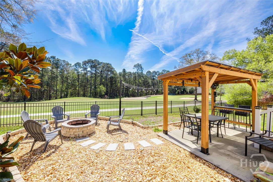 411 Plantation Place Rincon, GA 31326 - Photo 32 of 38 Entertainers back yard with pergola, fire pit overlooking the 7th hole of the golf course!