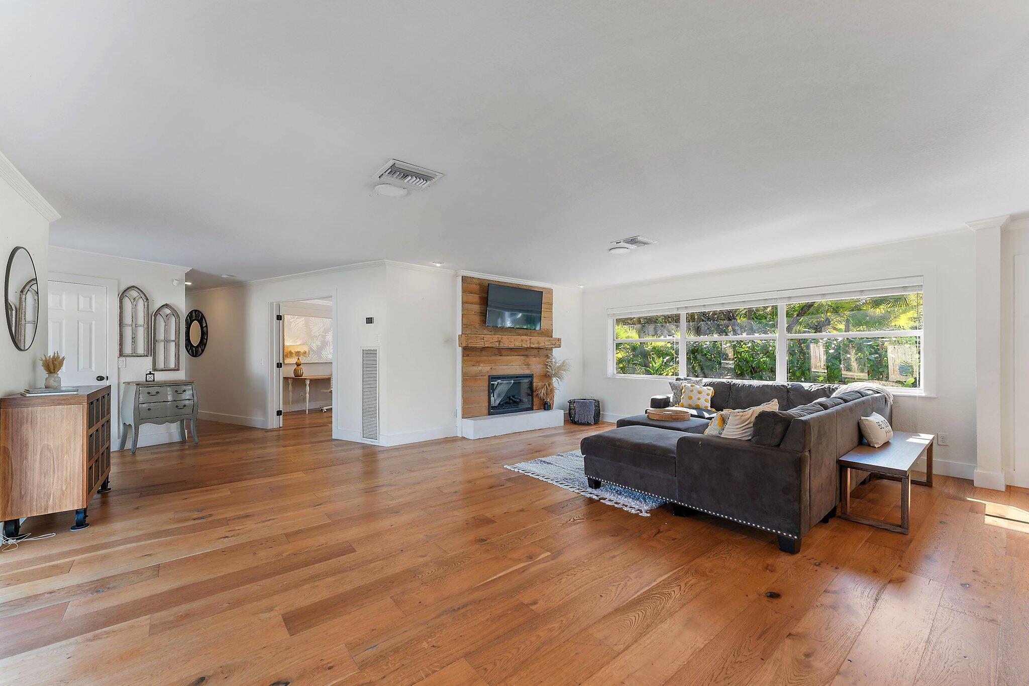 5692 Pennock Point Road Jupiter, FL 33458 - Photo 13 of 51 a living room with furniture and a large window