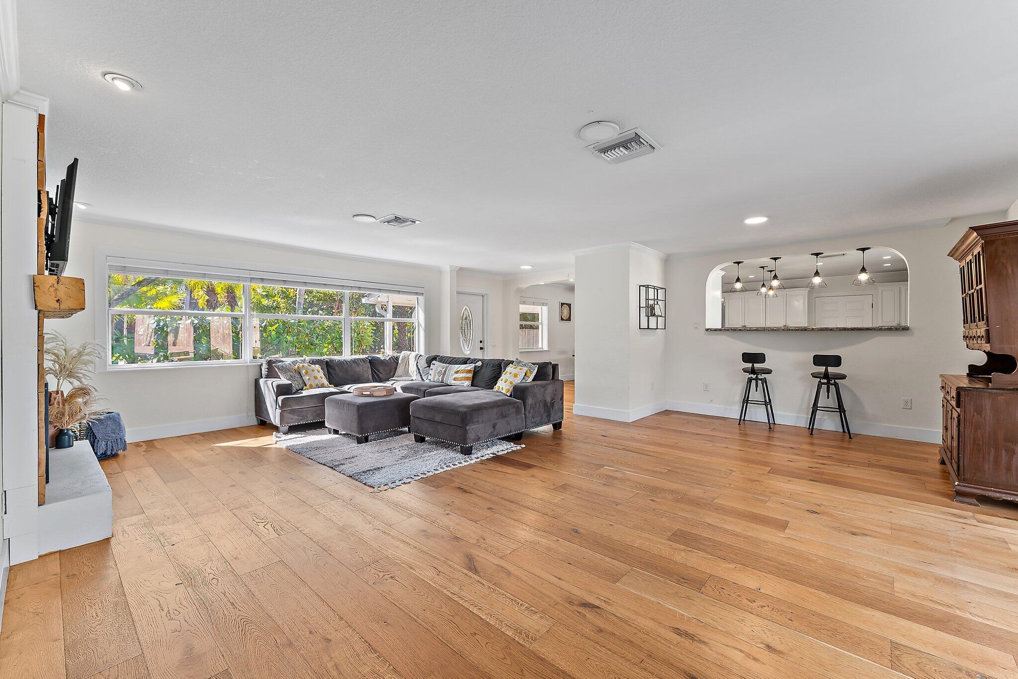 5692 Pennock Point Road Jupiter, FL 33458 - Photo 14 of 51 a living room with furniture and a flat screen tv