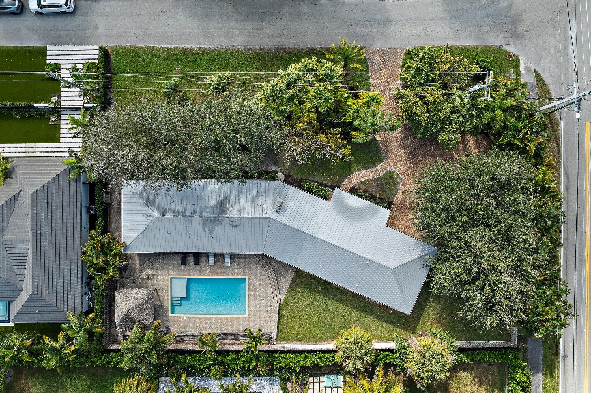 5692 Pennock Point Road Jupiter, FL 33458 - Photo 2 of 51 an aerial view of a house with a yard