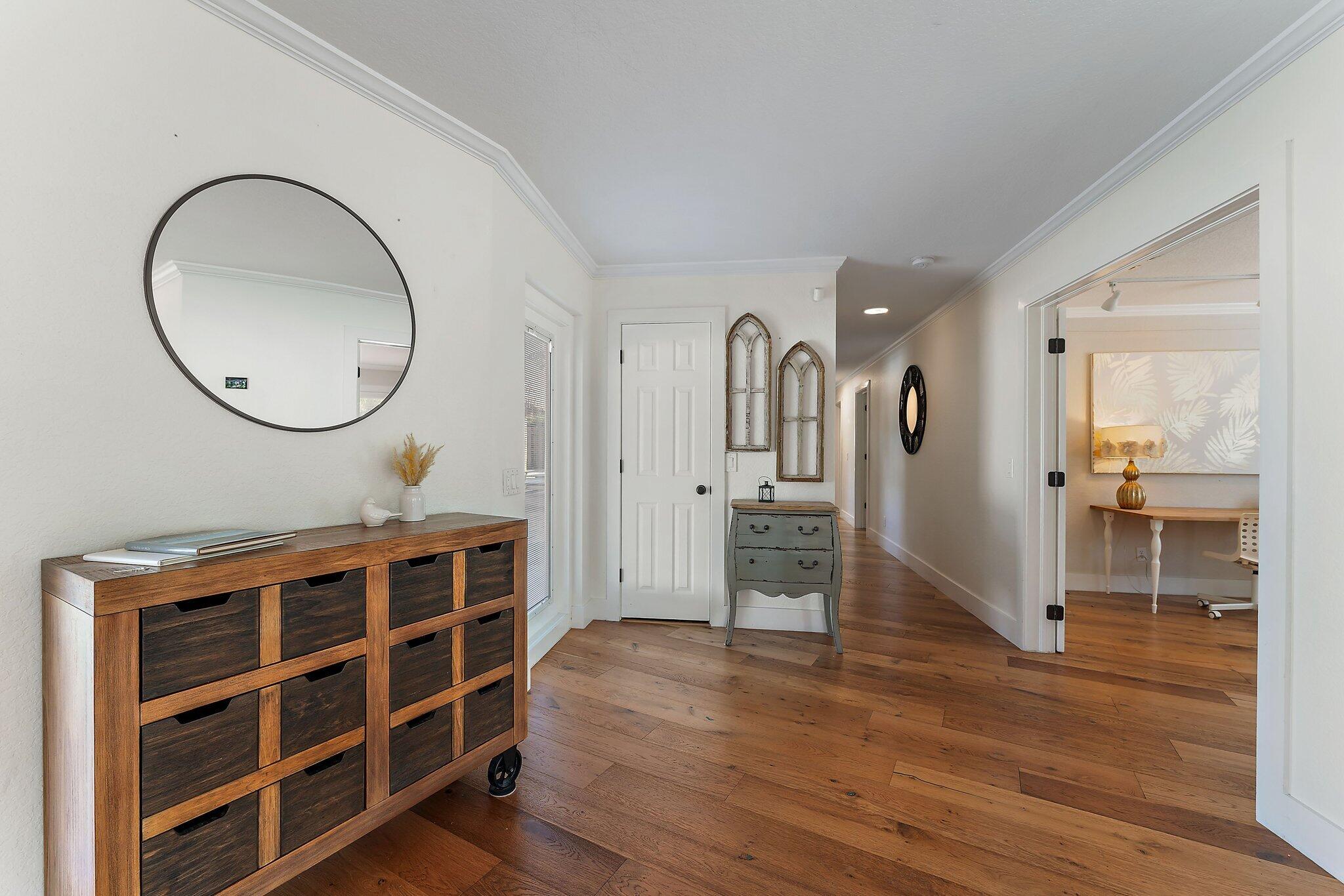5692 Pennock Point Road Jupiter, FL 33458 - Photo 21 of 51 a view of empty room with wooden floor and windows