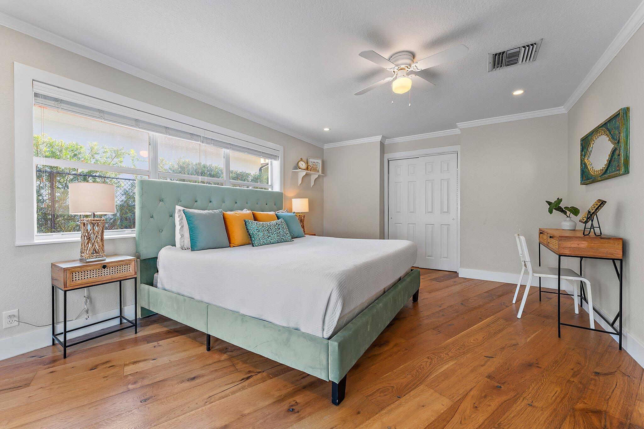 5692 Pennock Point Road Jupiter, FL 33458 - Photo 24 of 51 a bedroom with a bed and a table in it