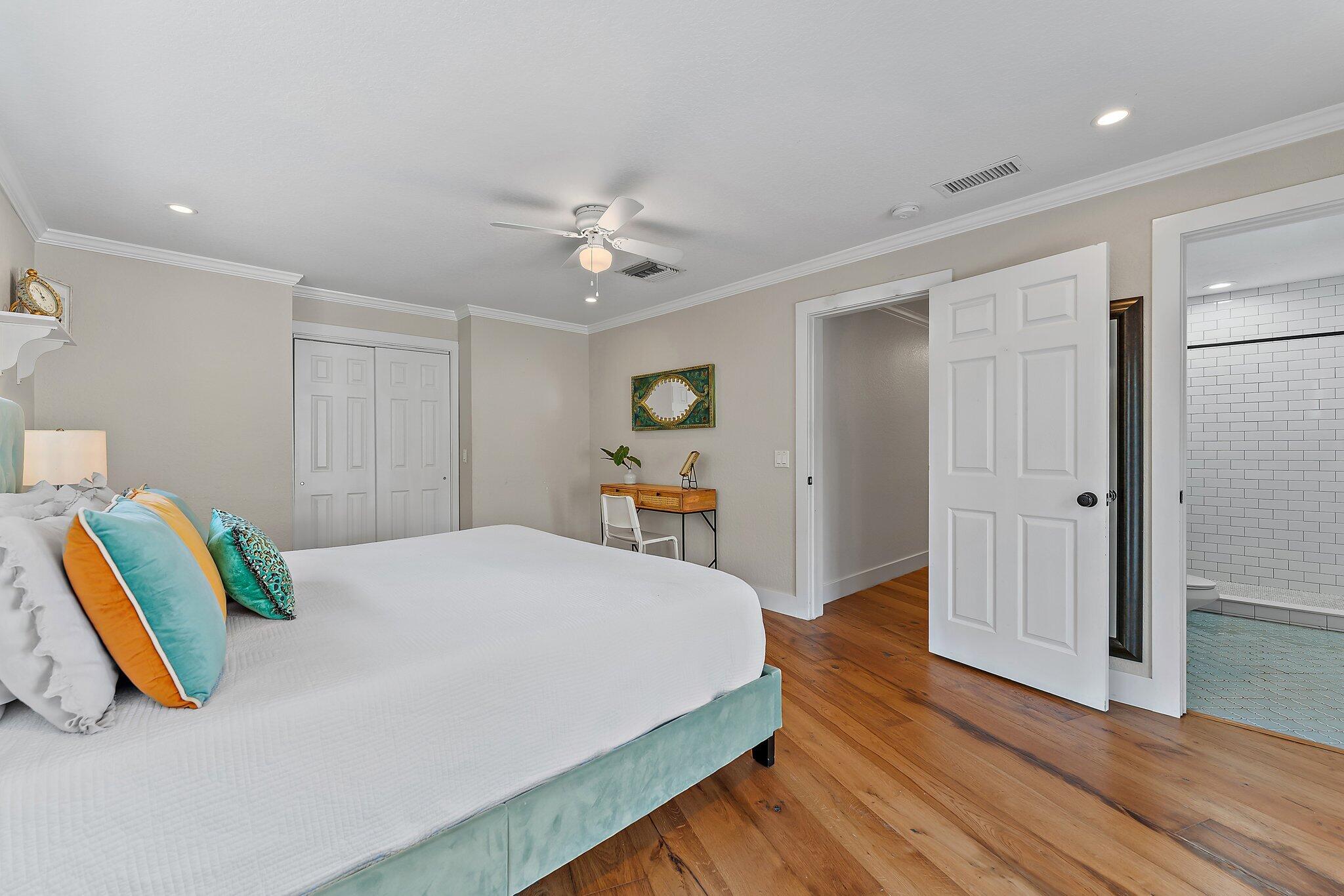 5692 Pennock Point Road Jupiter, FL 33458 - Photo 25 of 51 a bed room with a bed and a chandelier