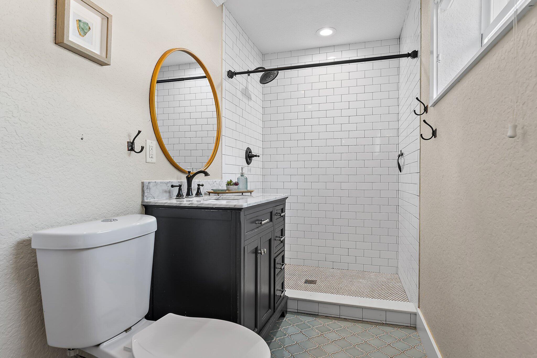 5692 Pennock Point Road Jupiter, FL 33458 - Photo 26 of 51 a bathroom with a sink toilet and shower