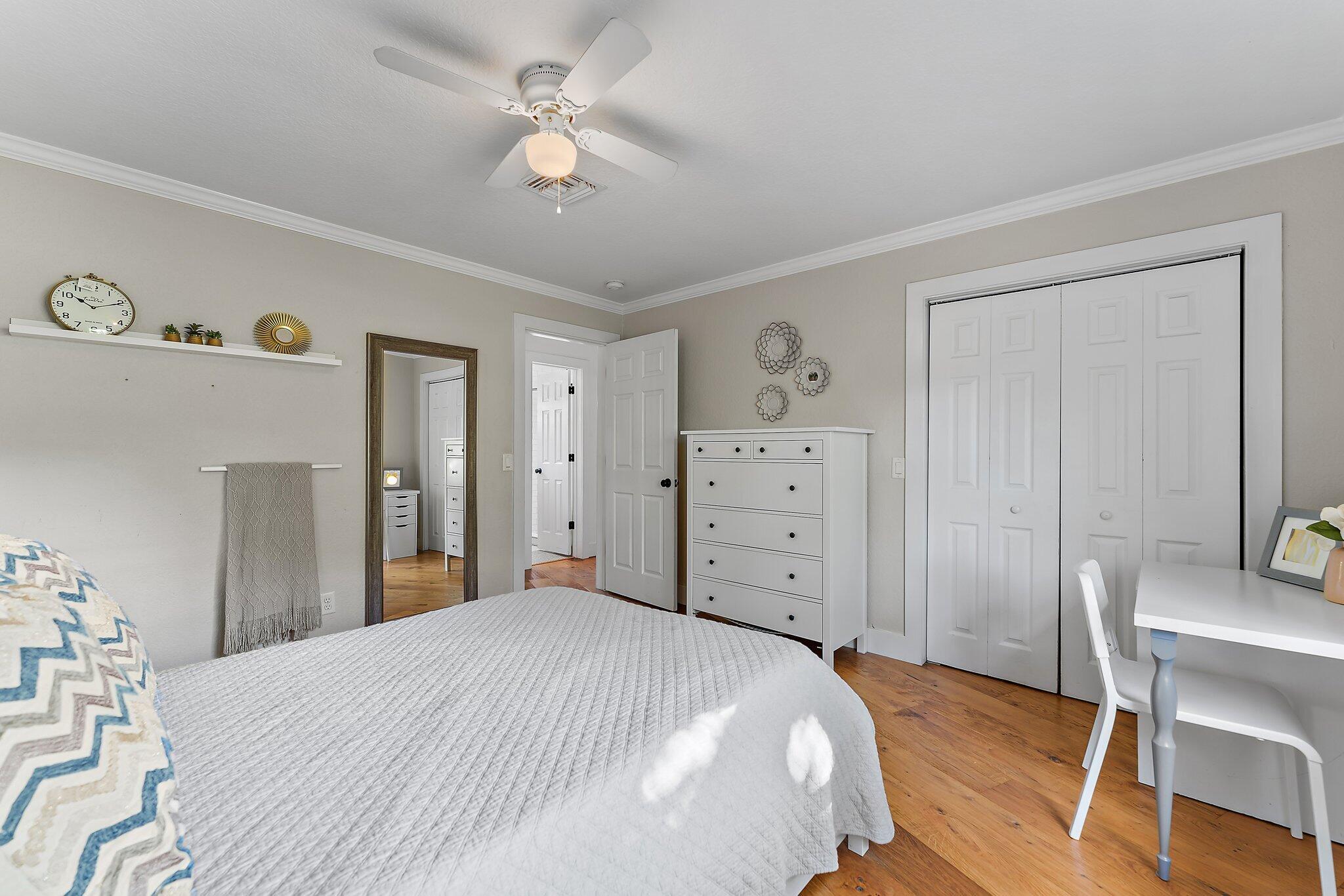 5692 Pennock Point Road Jupiter, FL 33458 - Photo 30 of 51 a bedroom with a bed and a dresser