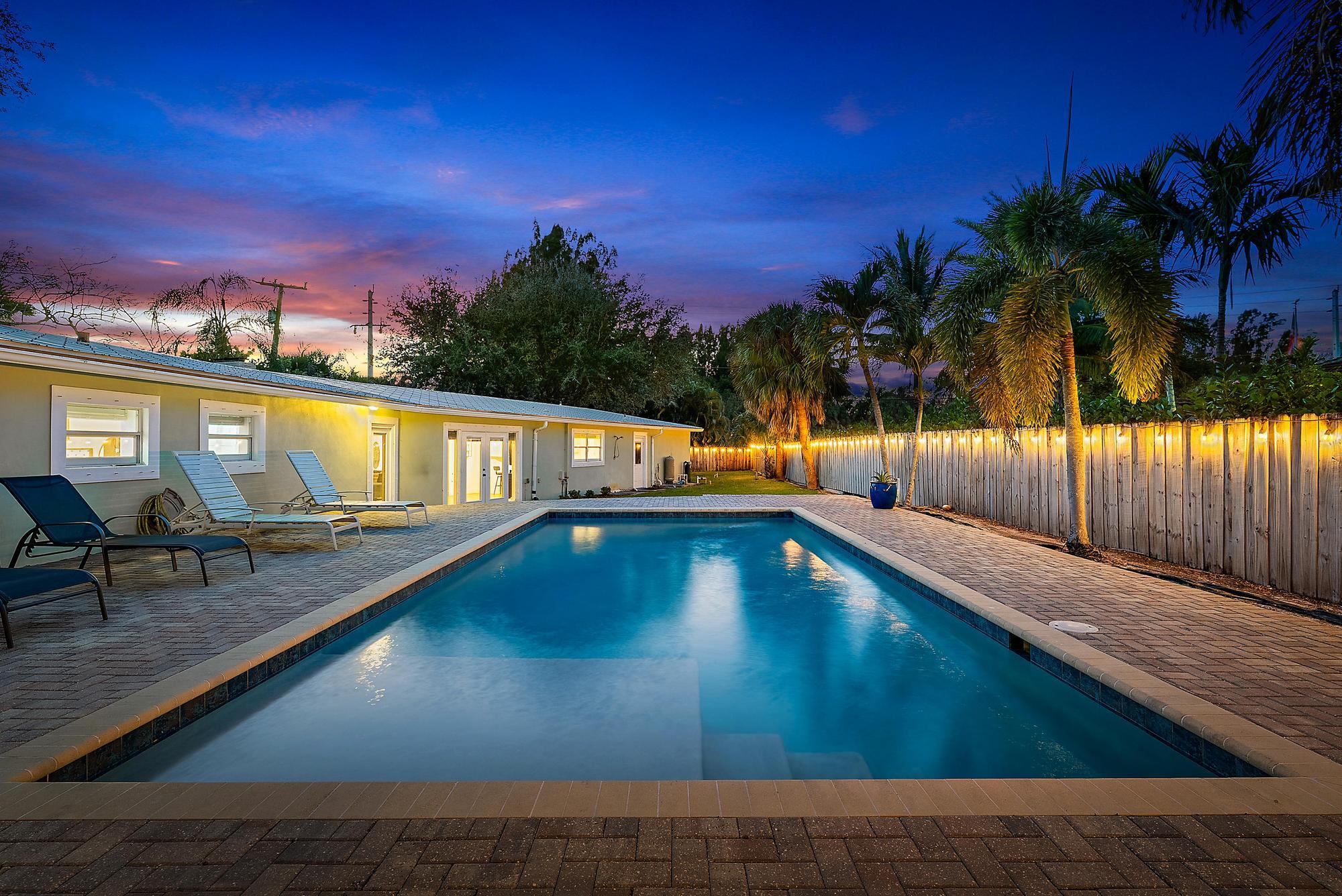 5692 Pennock Point Road Jupiter, FL 33458 - Photo 3 of 51 a view of swimming pool with a lounge chairs