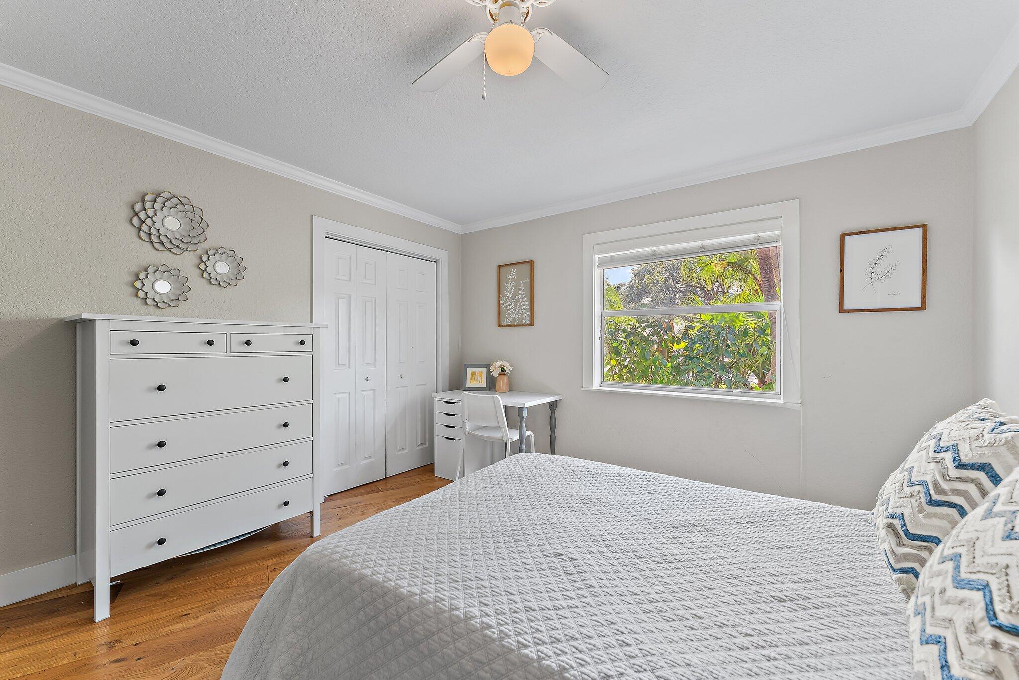 5692 Pennock Point Road Jupiter, FL 33458 - Photo 31 of 51 a bedroom with a bed and a window