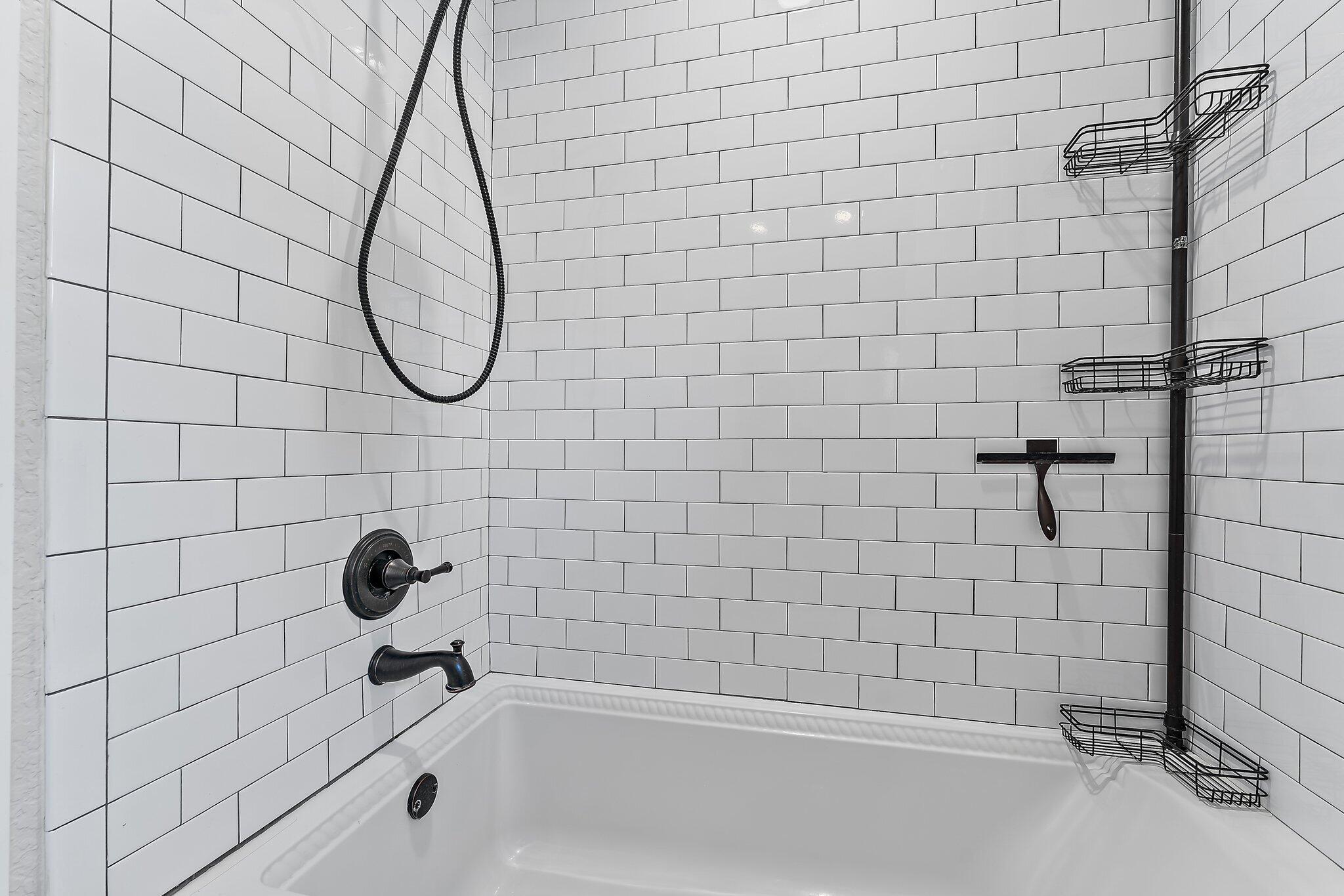 5692 Pennock Point Road Jupiter, FL 33458 - Photo 32 of 51 a bathroom with a shower and a bathtub