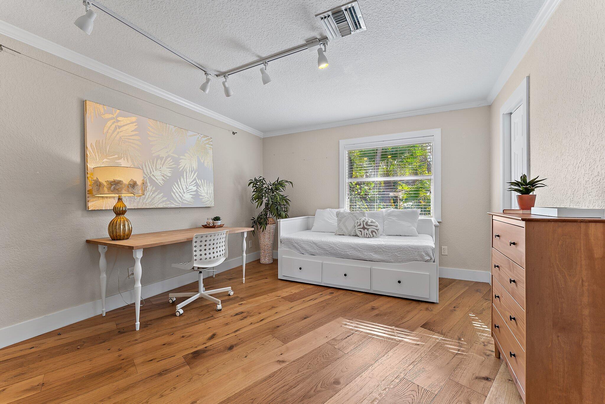 5692 Pennock Point Road Jupiter, FL 33458 - Photo 37 of 51 a living room with furniture and a wooden floor