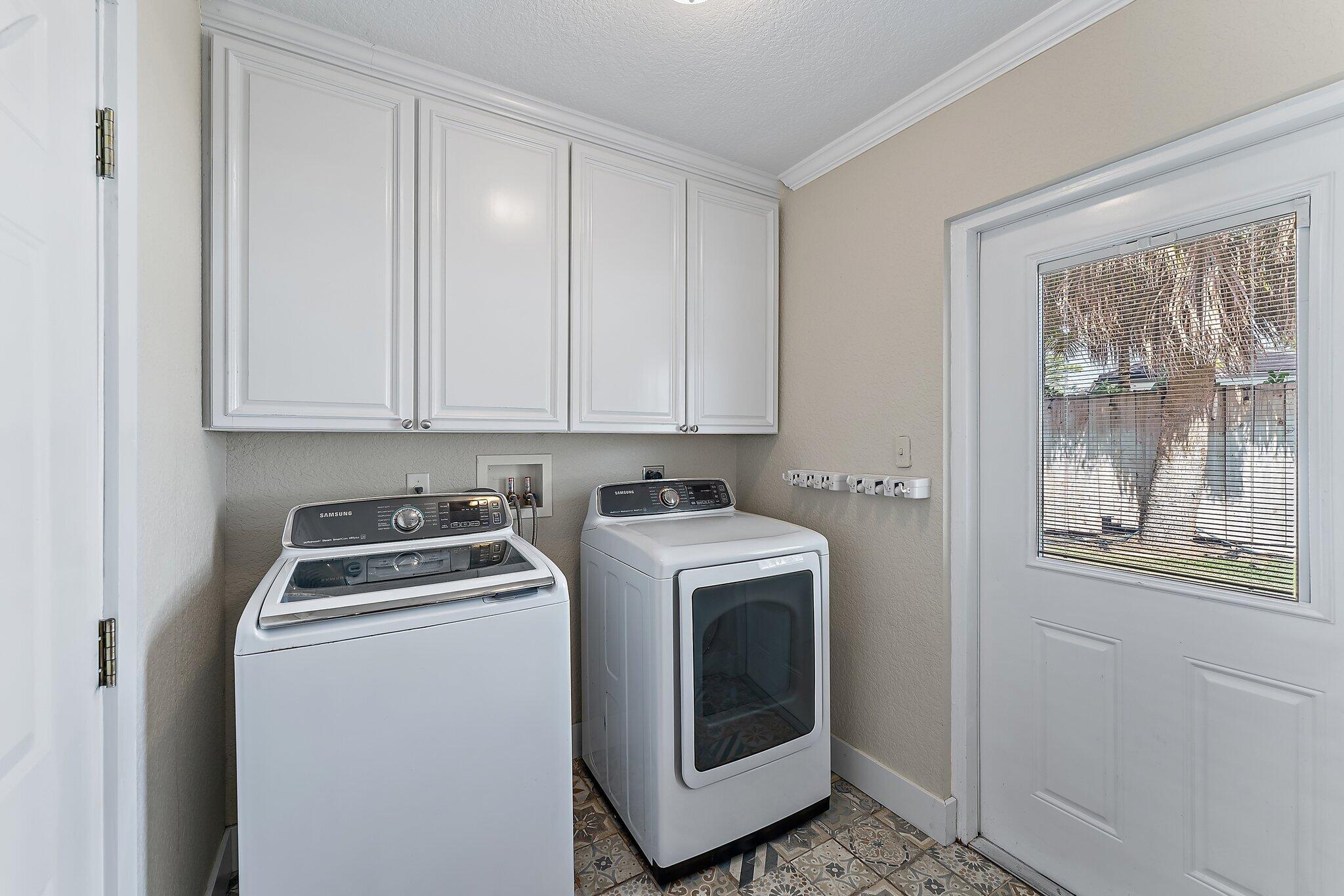5692 Pennock Point Road Jupiter, FL 33458 - Photo 41 of 51 a utility room with dryer and washer