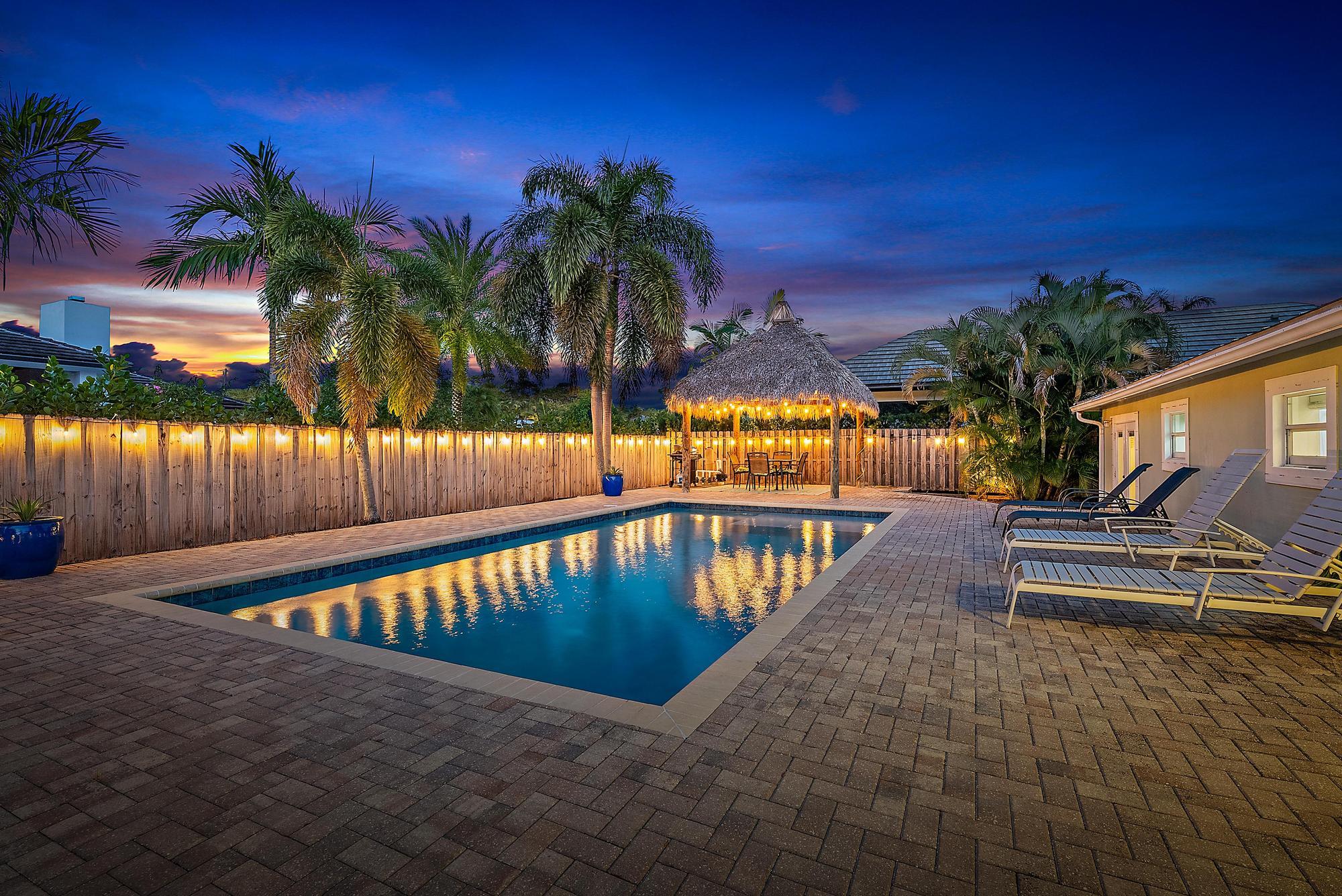 5692 Pennock Point Road Jupiter, FL 33458 - Photo 42 of 51 a view of swimming pool with a lounge chair