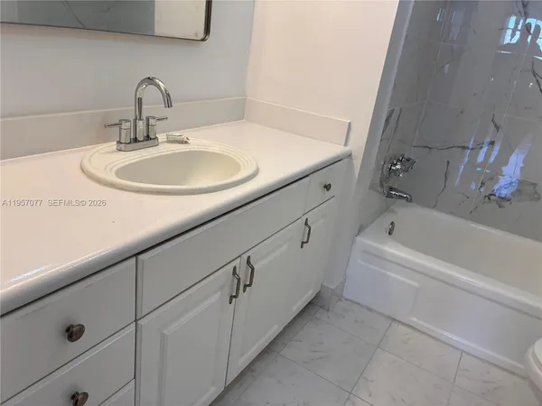 a bathroom with a sink and bathtub